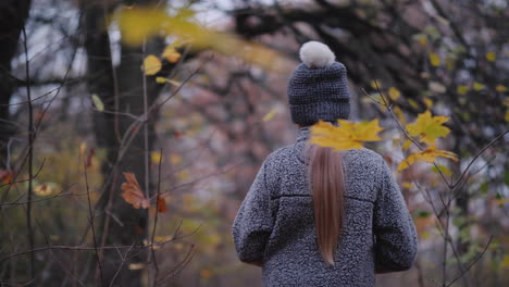 a little girl walks through a dark forest with a flashlight in her hand get lost in the forest conce