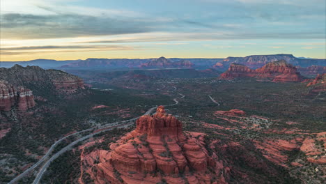 flying above bell rock at sunset near village of oak creek in arizona, usa