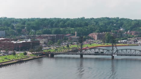 aerial low panning shot of the lfit bridge in downtown stillwater, minnesota. 4k