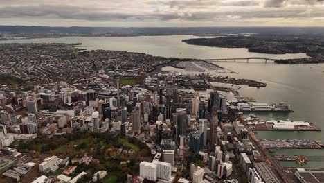 vast 4k 60fps high-altitude panoramic view of the auckland region. this epic aerial shot captures the city skyline, dual harbours, and the unique volcanic landscape from a bird's-eye perspective