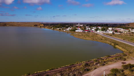 Aerial-arc-shows-N1-highway-next-to-dam-entering-Beaufort-West-in-Great-Karoo