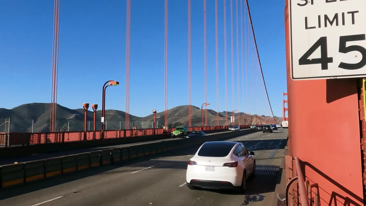 Traffic on the Golden Gate Bridge with Speed Limit Sign