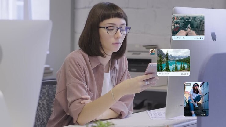 Woman using smartphone in office