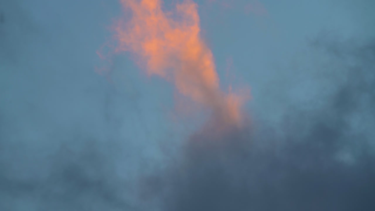 Majestic Clouds Slowly Lifting Through Sky