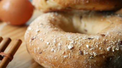 Close-up-of-bagels-and-egg-on-table-,