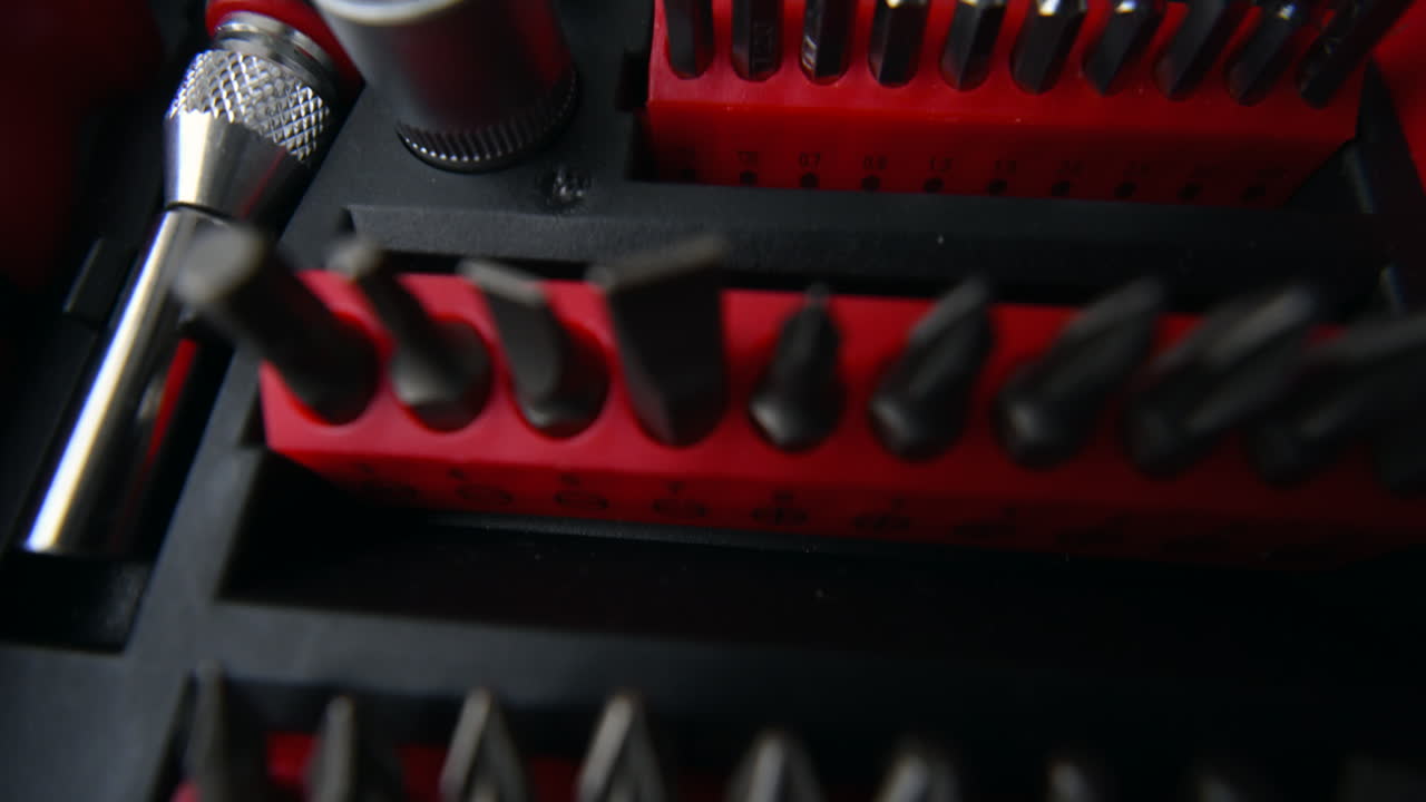Close up shot of a professional tool kit with screwdriver bits and sockets neatly organized