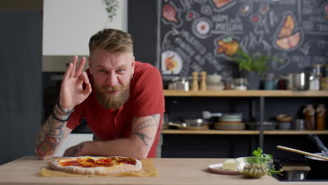 food blogger enjoying pizza smell and showing ok gesture