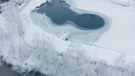 aerial view of a frozen lake in south tirol, italy