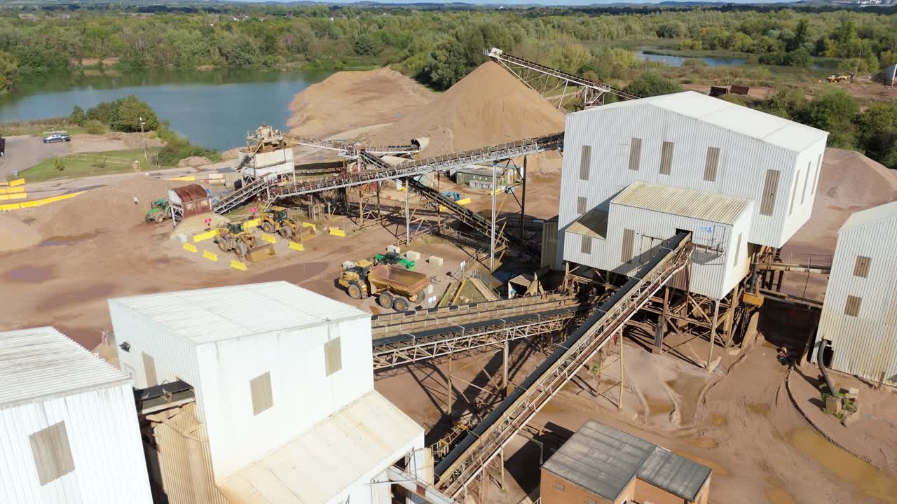 Aerial drone footage of quarry mining site with conveyor belts and sorting equipment, Nottingham, England