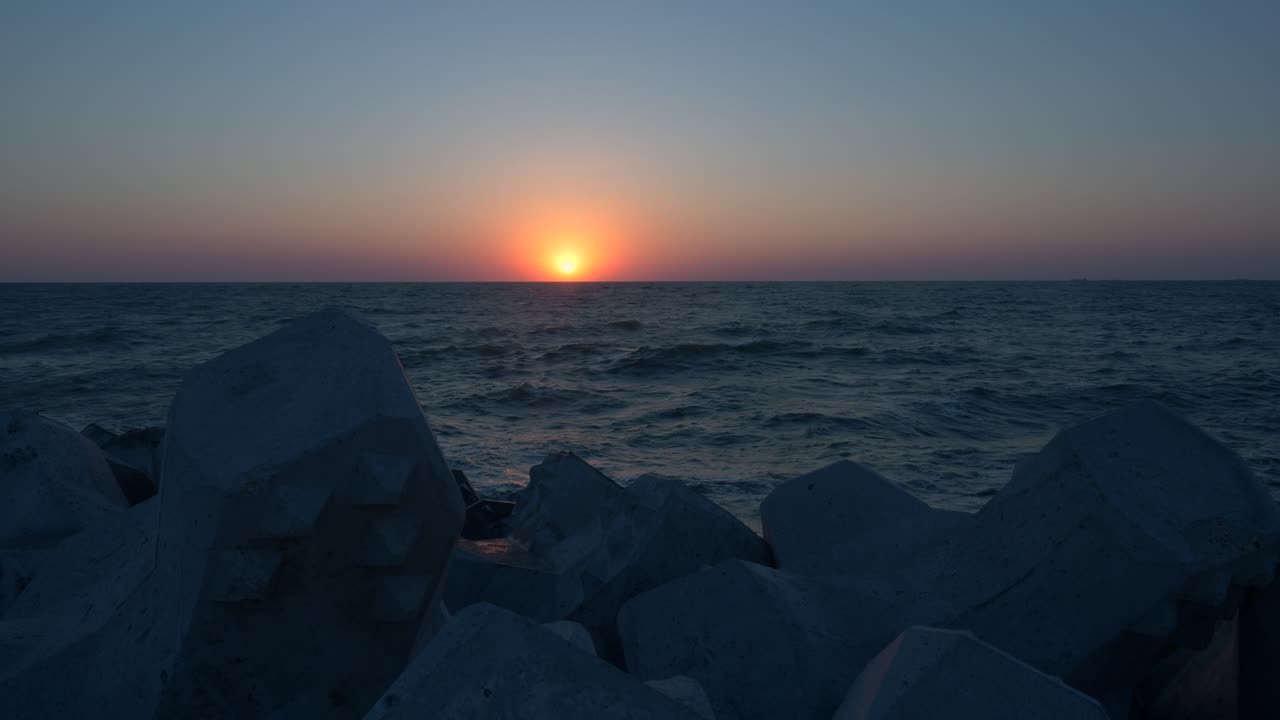 Sunrise over the sea. Yellow sun over sea. Orange colors. Nature background.