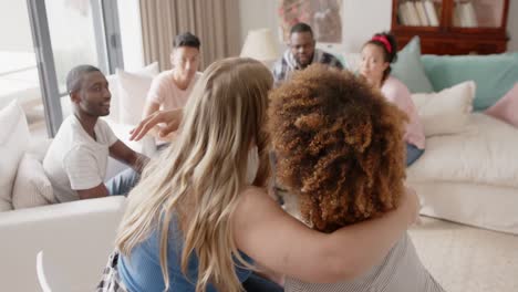 diverse friends talking and embracing at group therapy, slow motion