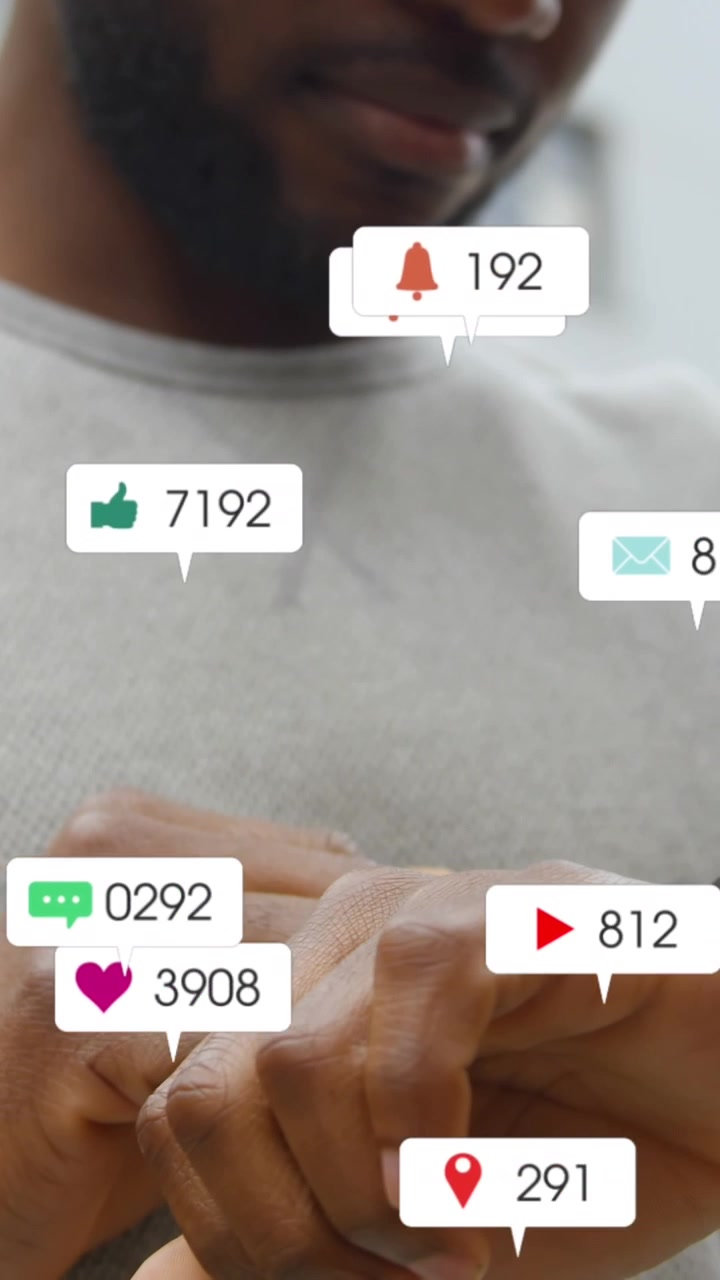 Animation of social media icons with numbers over african american man using smartwatch