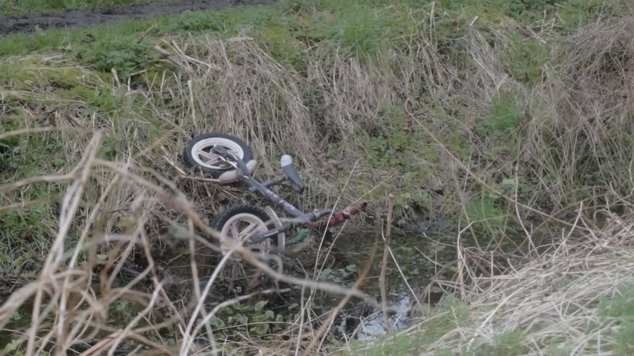 Child's bike found abandoned in stream
