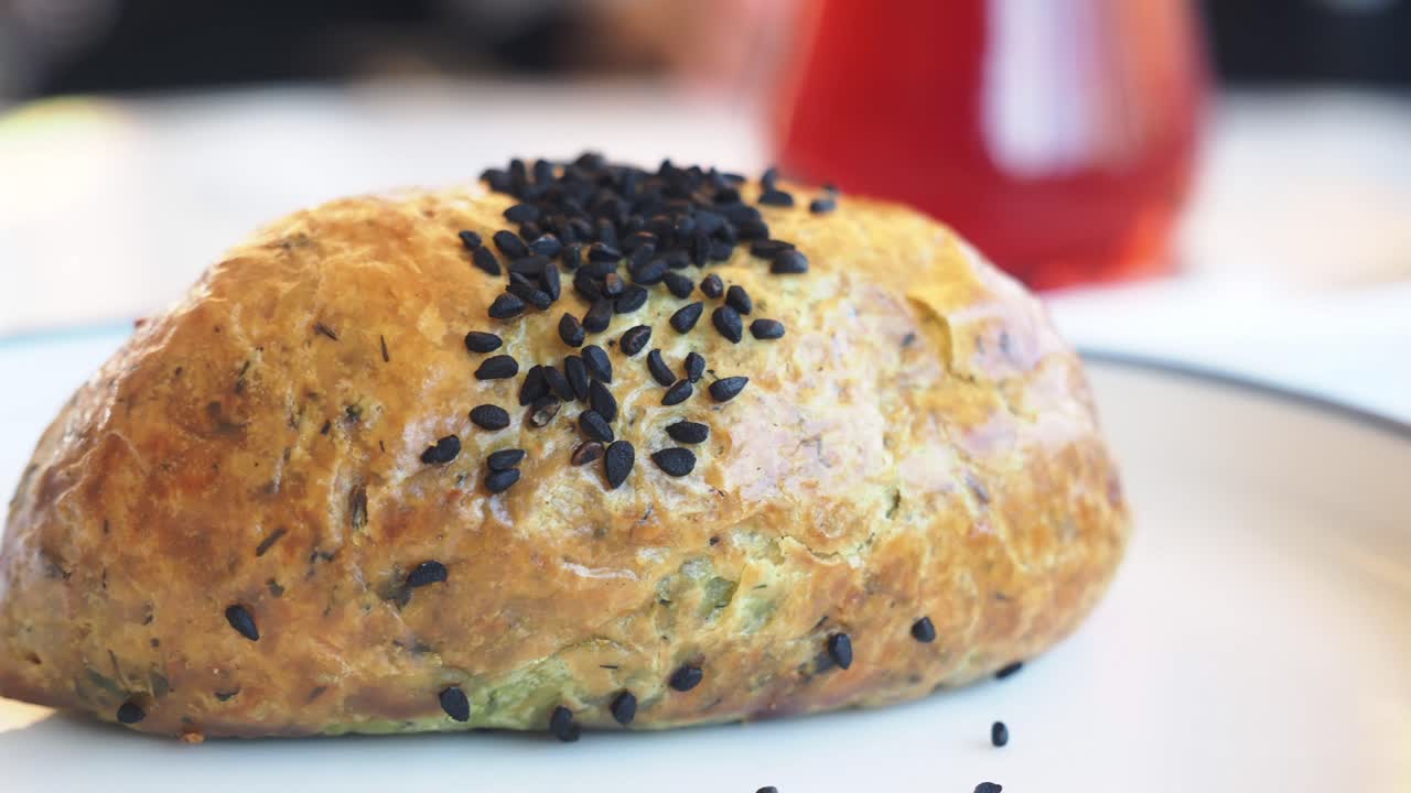 Close-up of a pastry with black sesame seeds