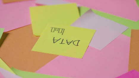 business concept of revolving sticky notes with data written on top note 1