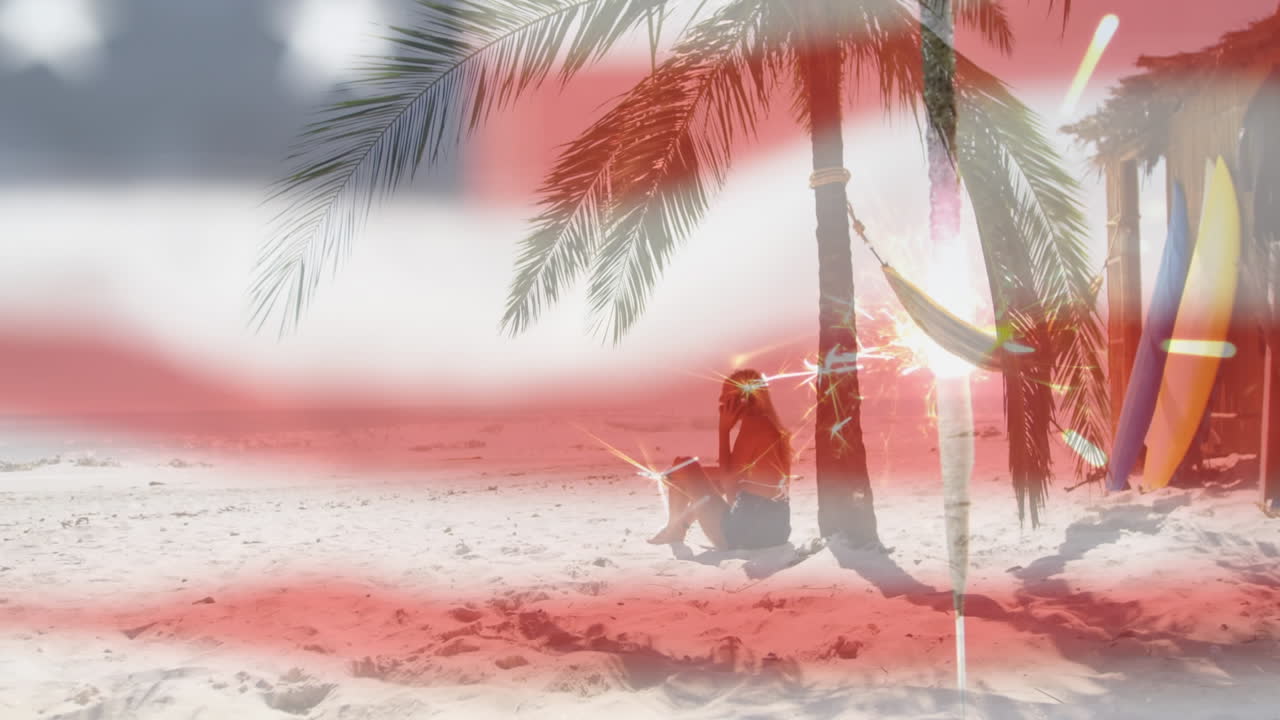 해변에 앉아 있는 여자 위에 흔들리는 미국  ⁇ 발의 애니메이션