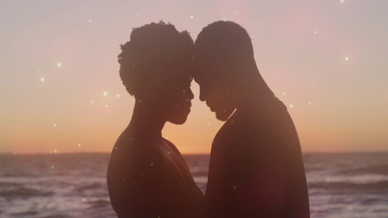 Embracing couple with sparkling lights in background during sunset animation