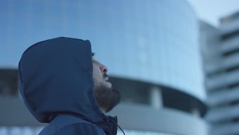 man in a hoodie, cityscape