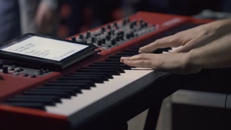 man hands playing piano