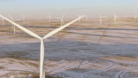 Aerial-shots-of-wind-turbines-on-a-cold-winter-afternoon-in-Calhan,-Colorado