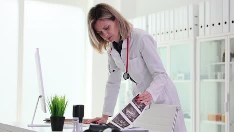 female doctor working on computer in medical office