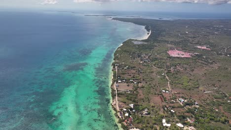 aerial view of a tropical coastline with turquoise water