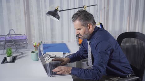 Mature businessman working in the office.