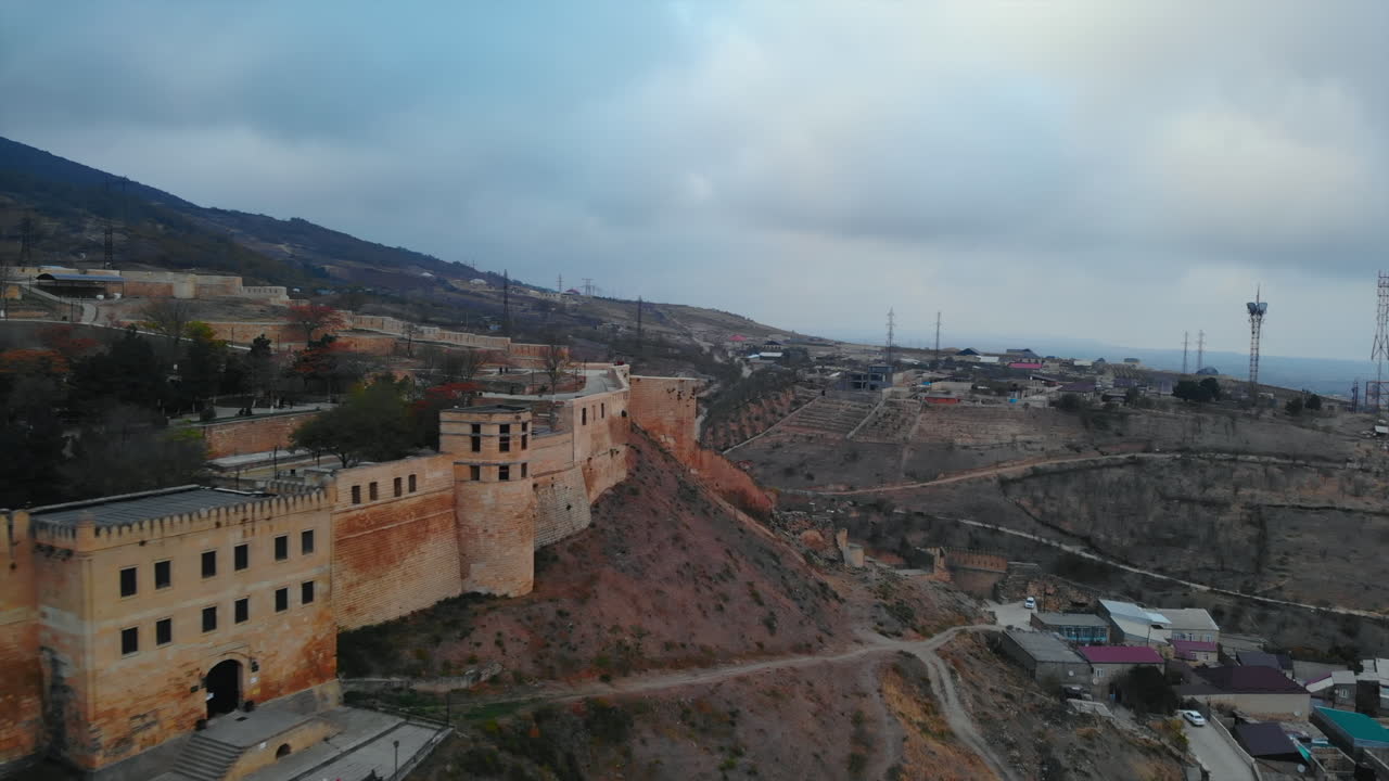Aerial view of a historic fortress on a mountain