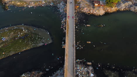 Water-pollution-in-Vietnam:-people-in-toxic-environment-of-plastic-waste,-aerial