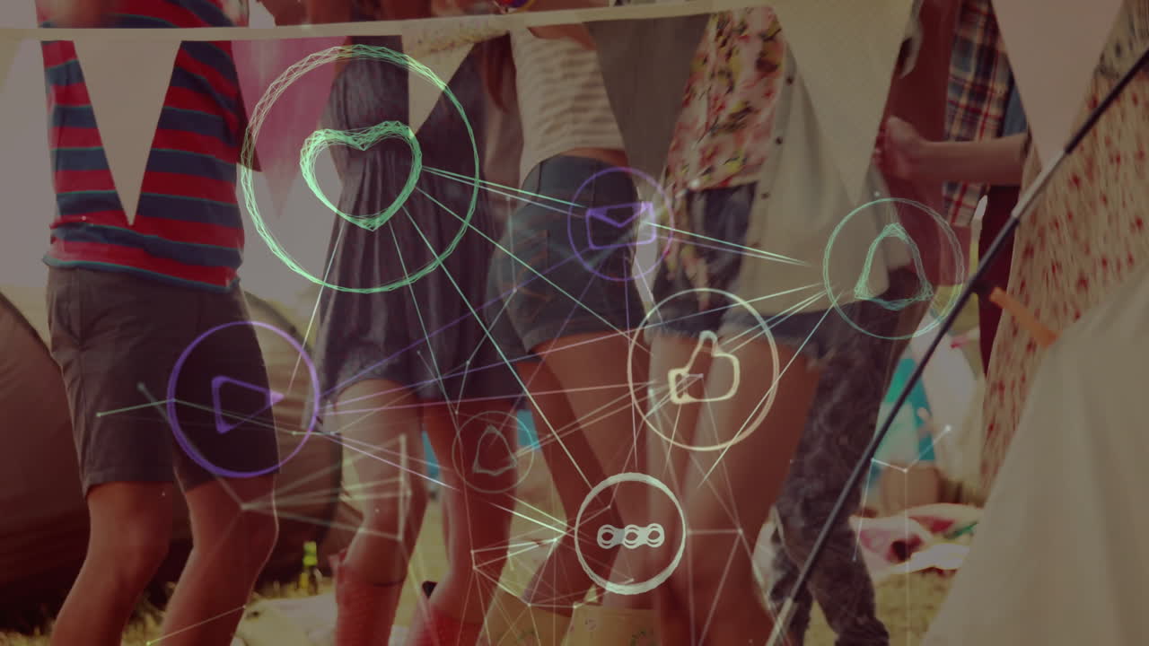 Network of social media icons animation over people dancing at outdoor event
