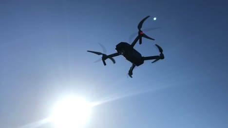 agriculture. innovations. smart technological drone analyzing field flying against sunny sunset sky landscape. digital device