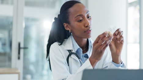 Doctor,-laptop-and-black-woman-typing-pills-info