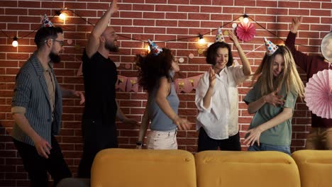 young people dancing out rocking birthday party celebrating exciting holiday at home