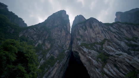 misty cave entrance in mountain