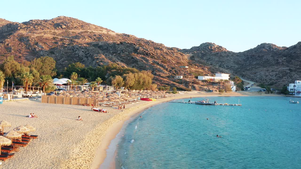 Aerial Drone View Mylopotas Beach in Ios Island Greece during Sunset Dusk