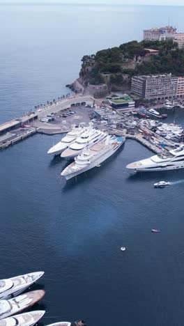 monte carlo, monaco. vertical aerial view of harbor, cruise ship and yachts, revealing drone shot