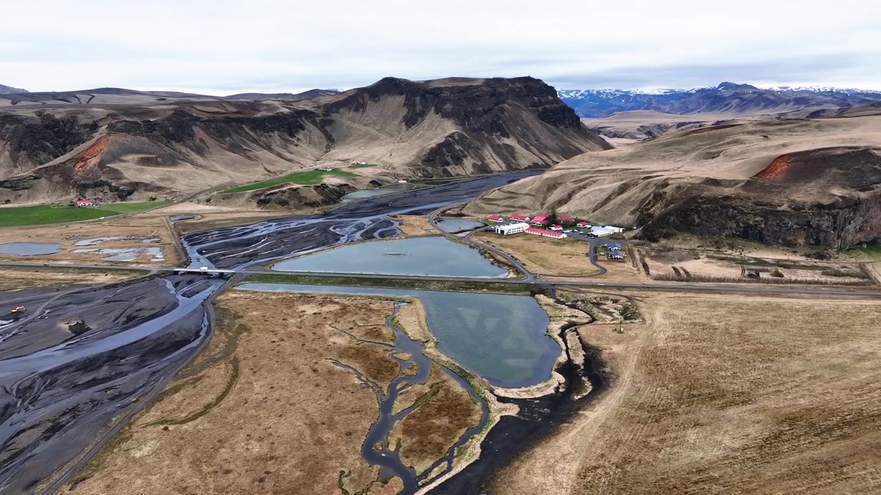 Flying over volcanic landscape in Iceland on a cloudy day