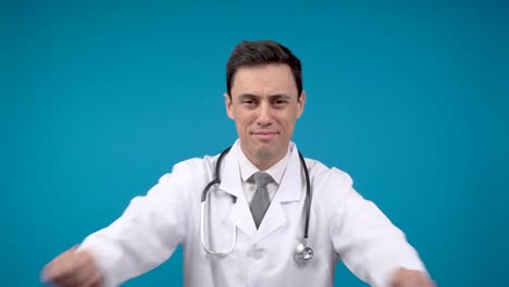 professional male doctor posing on blue background