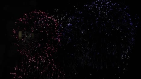 Animación-Digital-Del-Texto-Dorado-De-Feliz-Año-Nuevo-Contra-Fuegos-Artificiales-Que-Explotan-Sobre-Fondo-Negro