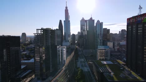 Excellent-Aerial-View-Of-Cars-Driving-Past-Skyscrapers-In-Philadelphia,-Pennsylvania