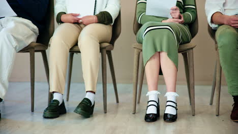 people waiting for a job interview in a waiting room