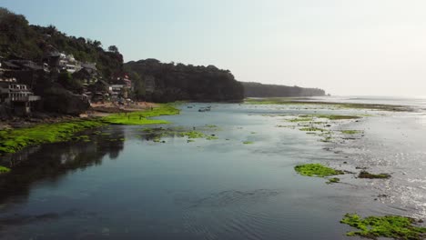 The-town-of-Bingin-at-the-cliffs-of-Uluwatu-during-low-tide