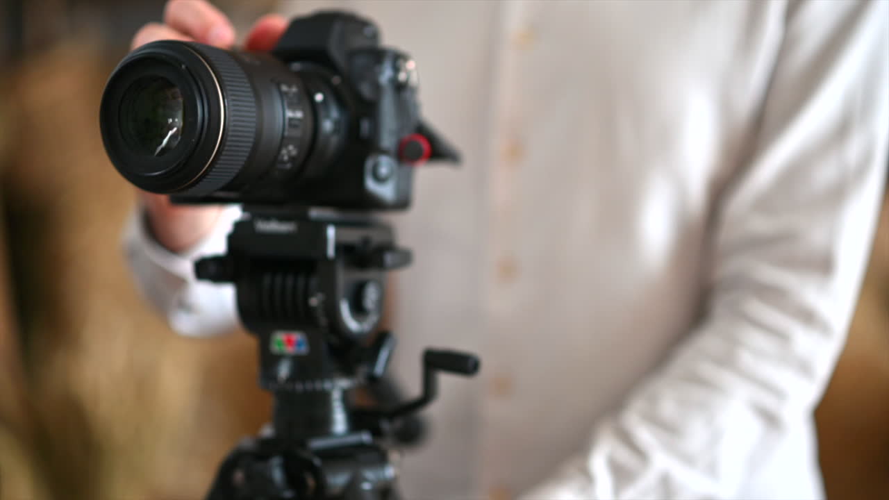 Man setting up profesional camera for a photoshoot