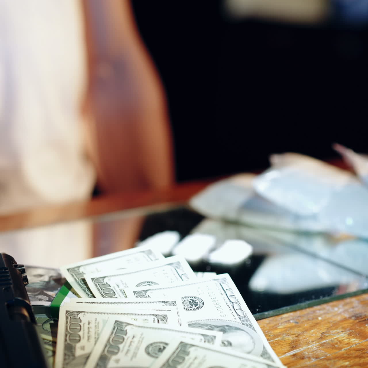 Gun, drugs and money. Drug dealer stacks the heroin filled bags Square video