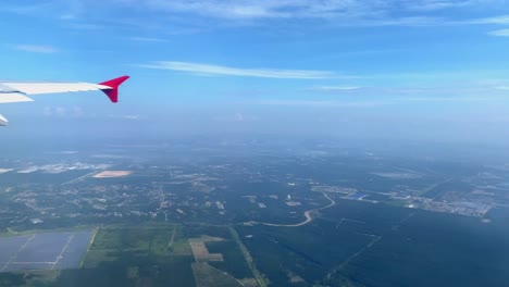 Beautiful-aerial-view-seen-through-window-of-flying-airplane