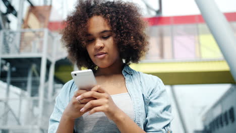 teenage girl texting on smartphone