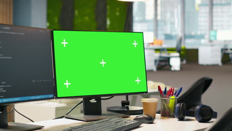 green screen computer display in modern startup office displaying code snippets