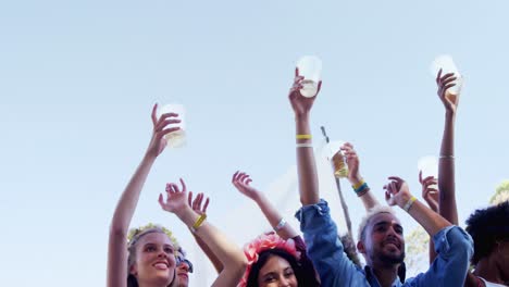 group of friends having fun at music festival 4k