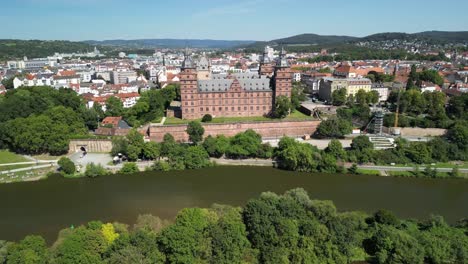 city rooftops and castle with river main in aschaffenburg, bavaria, germany