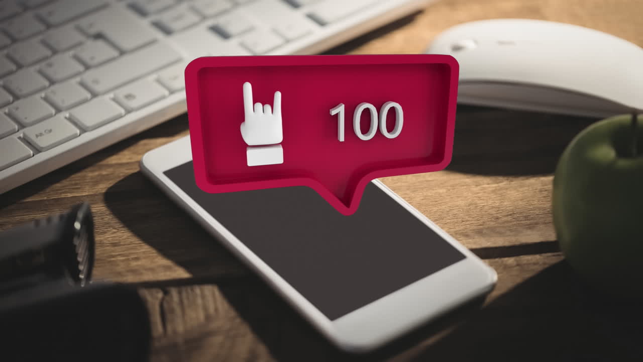 mesa con un teclado, un ratón y un teléfono móvil y una roca en el icono